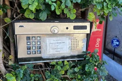 A keypad with worn buttons before replacement