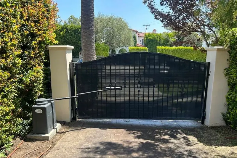 A safety sensor bracket knocked out of alignment on a gate post