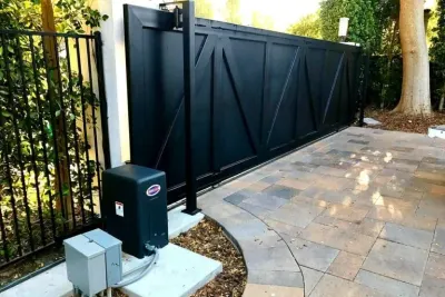 An Eagle swing gate operator connected to an iron gate post