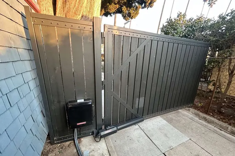 A buried cable run exposed at a gate post during fault tracing