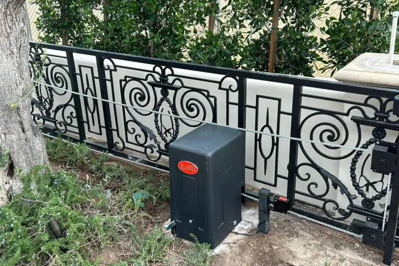 A gate operator control board showing a fault, with the enclosure open