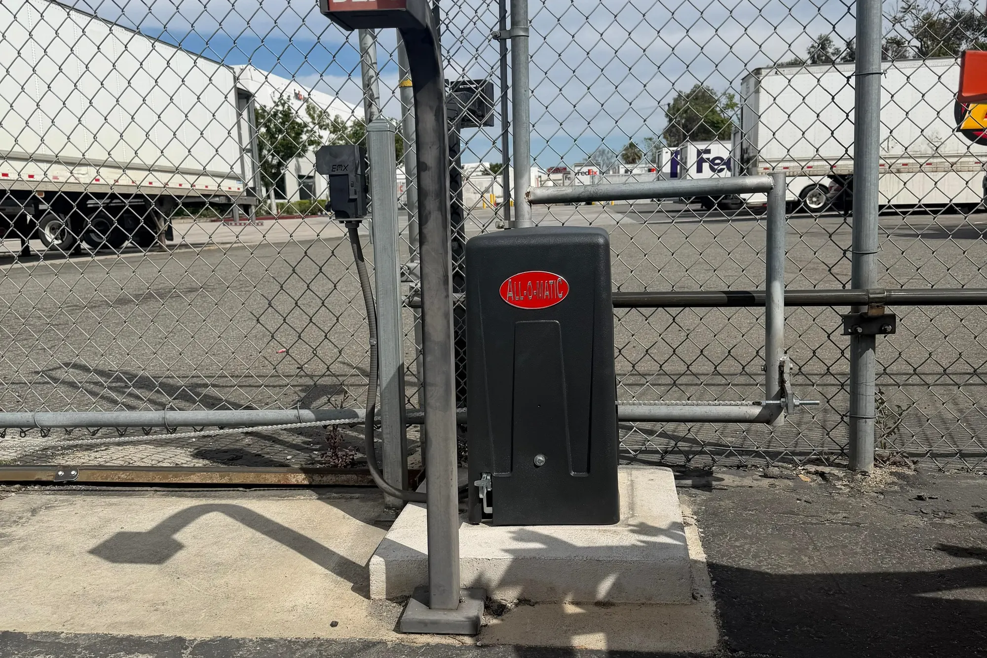 A burnt-out gate operator motor removed and set aside for replacement