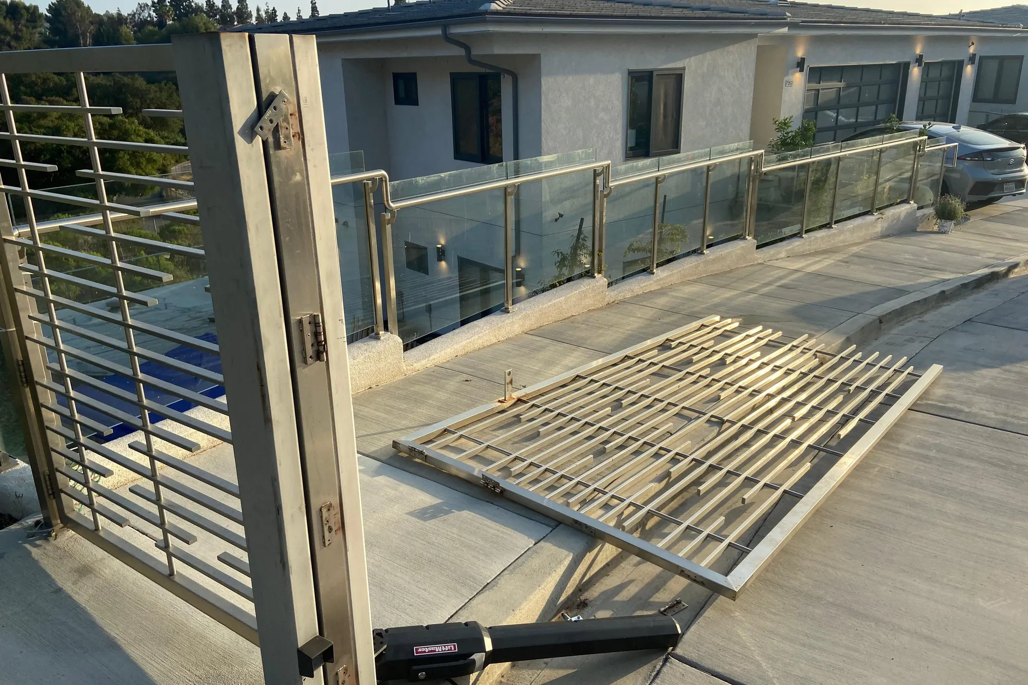 Grinding and finishing a weld repair on an iron gate frame