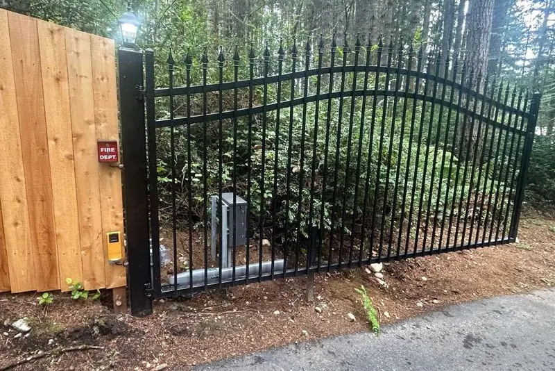 A Viking swing gate operator arm attached to a heavy metal gate leaf